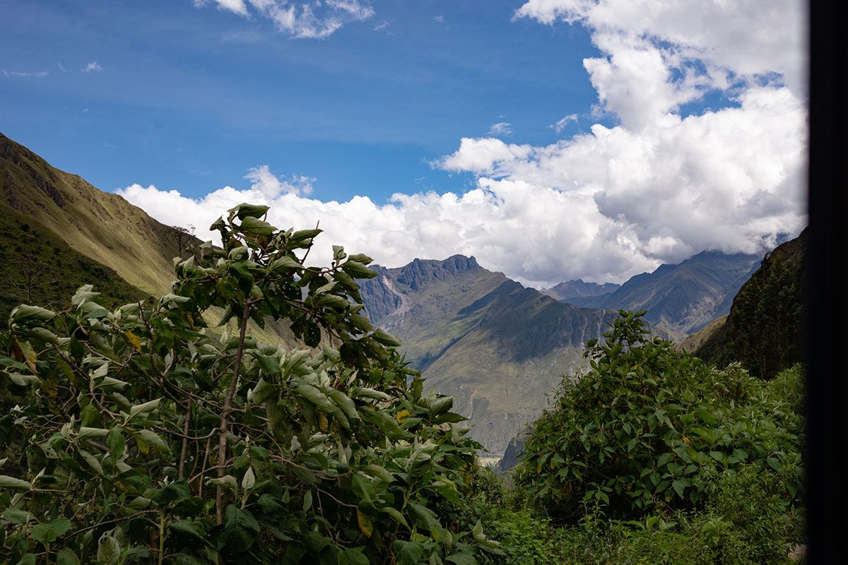 View of a mountain panorama that reaches into the clouds.