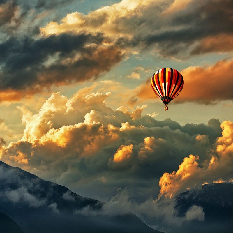 Picture of a hot air balloon in the clouds