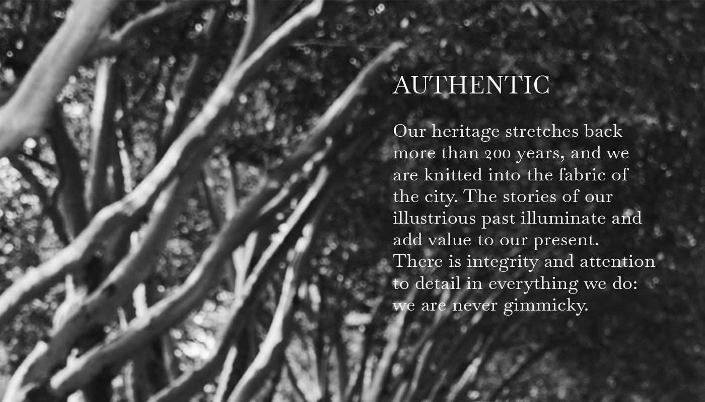 A black and white photo of an avenue with a text on the topic of "Authentic"