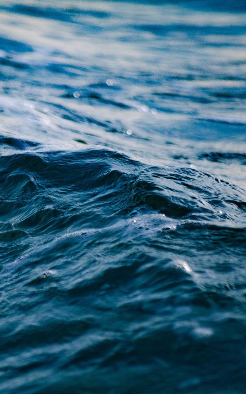 Close up of a wave in deep blue water